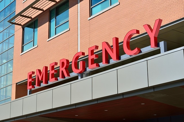 The exterior red signage letters of a hospital emergency department