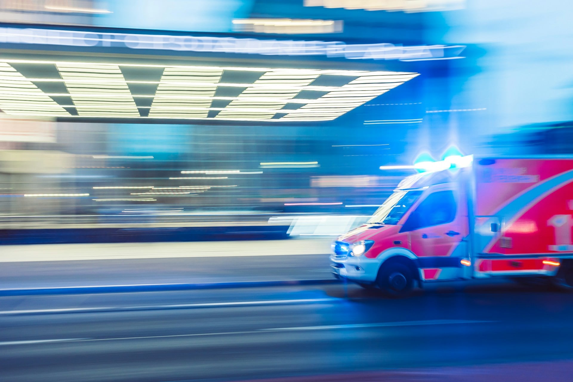 A motion blur depiction of an ambulance rushing to a location